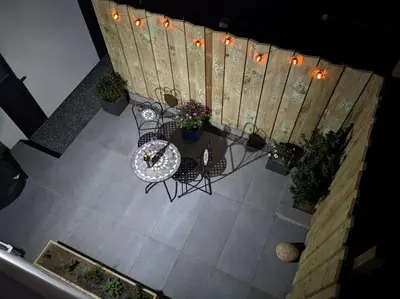 an overhead view of a table and chairs and a fence at Modern cosy apartment walking distance to many cove beaches and coast path walks as well as the famous Helford river in Falmouth