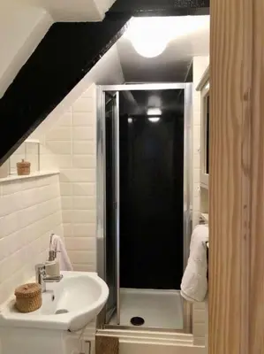a bathroom with a shower and a sink at Coombe Cottage in St. Agnes