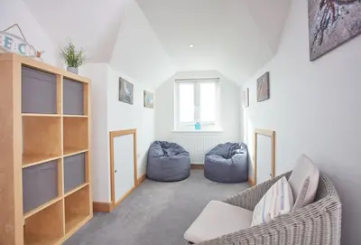 a living room with a couch and two bean bags at Little Seawynds in Port Isaac