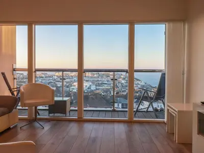 a living room with a view of the city at 10 Quay Court in Newquay