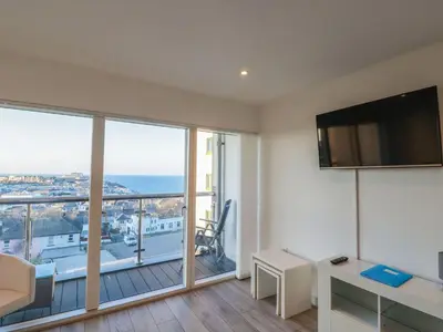 a living room with a view of the ocean at 10 Quay Court in Newquay
