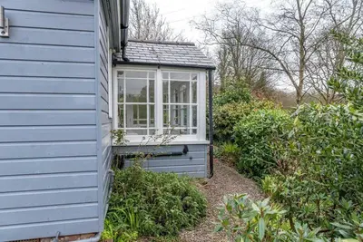 a small window on the side of a house at Lower Hill Cottage w/Swedish Hot Tub in Bodmin