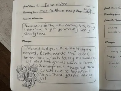 a page of a book with handwriting on it at Modern Lodge with Amazing Views in Newquay