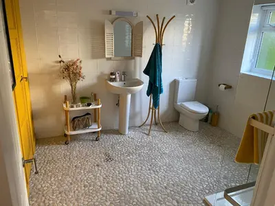 a bathroom with a sink and a toilet at 5 SEAVIEW private parking w EV in Saint Mawes