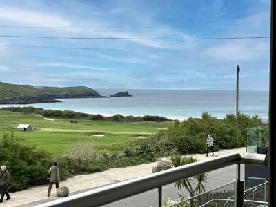 a view of a golf course and the ocean at 24 Zinc in Newquay