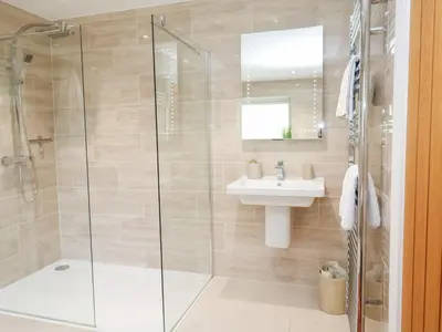 a bathroom with a shower and a sink at Little Roskrow in Penryn