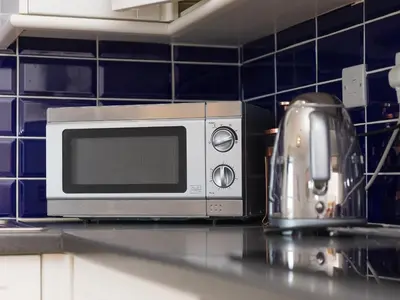 a microwave sitting on a counter in a kitchen at 5 St Brigids in St Ives