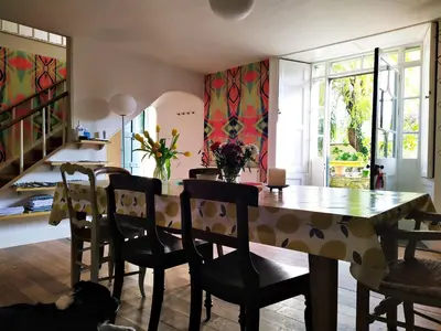 a dining room with a table and chairs at Quay Street in Lostwithiel