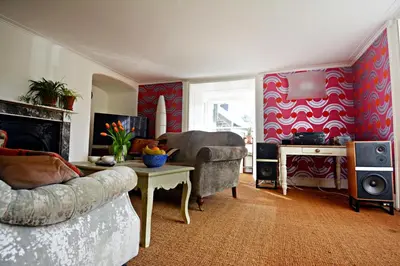 a living room with a couch and a table at Quay Street in Lostwithiel