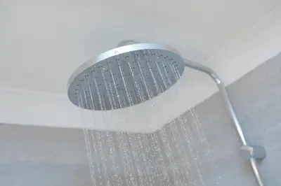 a shower head with water hanging from the ceiling at Wavetop in St Ives