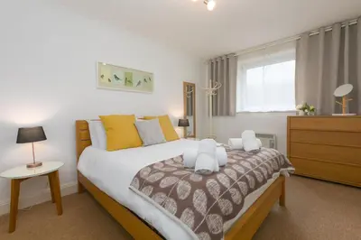 a bedroom with a bed with two teddy bears on it at 28 Carrack Widden in St Ives