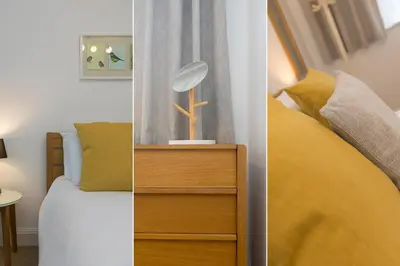 a bedroom with a bed and a lamp on a dresser at 28 Carrack Widden in St Ives