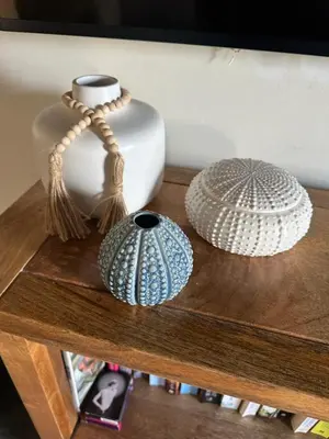 three vases sitting on a wooden table at Stable Door Cottage in Newquay