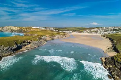 an aerial view of a beach with the ocean at Stable Door Cottage in Newquay