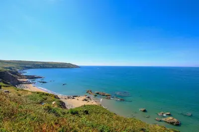 a view of the ocean from a hill at Mesmerising sea views - Penrose - above the beach Cornwall. in Downderry