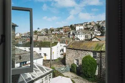 a view of a city from a window at The Sail Loft (part of Manor House) in Port Isaac