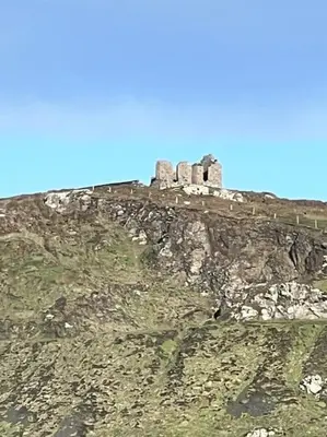 a castle on top of a rocky mountain at The Hive in St Austell