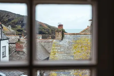 a view from a window of roofs at The Manor House in Port Isaac