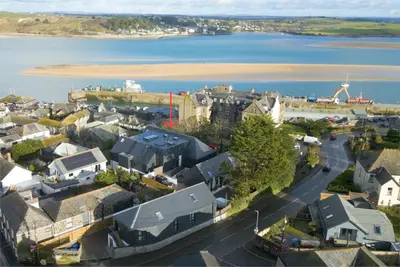 an aerial view of a town next to the water at Stylish estuary view apartment in Padstow