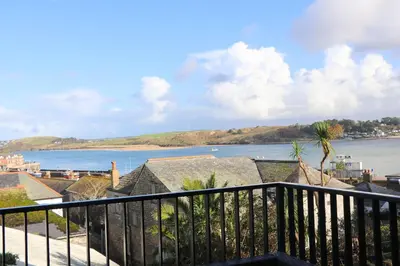 a view of the ocean from a balcony at Stylish estuary view apartment in Padstow