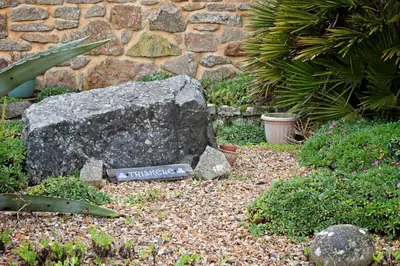 a rock in the middle of a garden at Beautiful Cornish Home 