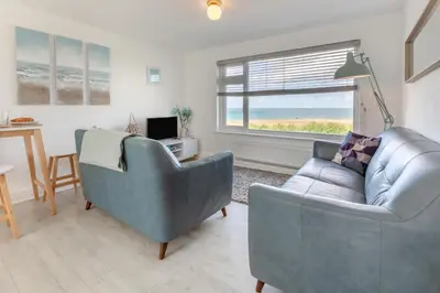 a living room with two chairs and a couch at 2 Bed in Newquay oc-a28105 in Newquay