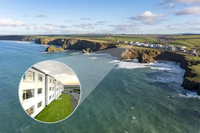 a building on the edge of a body of water at 2 Bed in Newquay oc-a28105 in Newquay