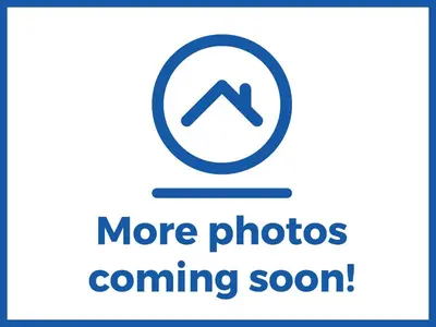 a sign that says more photos coming soon at Harbour Light in Boscastle