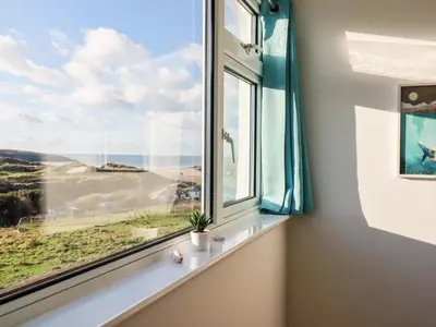 a window with a view of the ocean at Seacroft in Newquay