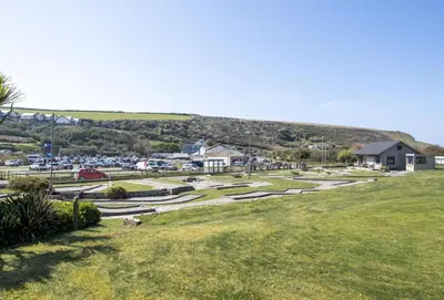 a view of a park with a parking lot at 3 Europa Court in Mawgan Porth in Mawgan Porth