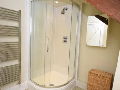 a shower with a glass door in a bathroom at 4 Bed in Tintagel oc-tolbo in Tintagel