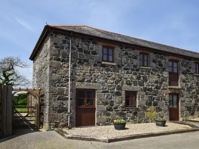 an old stone house with a wooden door at 3 Bed in Helston oc-htfox in Saint Martin