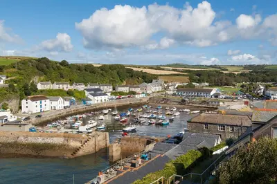 a group of boats in a harbor in a town at Chy Lowen in Helston