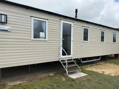 a ladder is on the side of a mobile home at Perranporth Beach 3 Bed Holiday Home Cornwall. in Perranporth