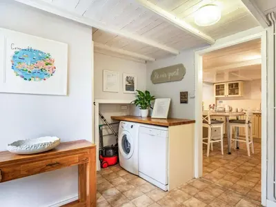 a laundry room with a washer and dryer at 4 Bed in Lostwithiel oc-51028 in Lerryn