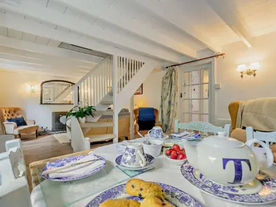 a dining room with a table with a tea set at 2 Bed in St. Agnes oc-72422 in St. Agnes