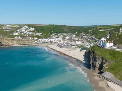 an aerial view of a beach with houses at 2 Bed in Truro oc-86648 in Porthtowan