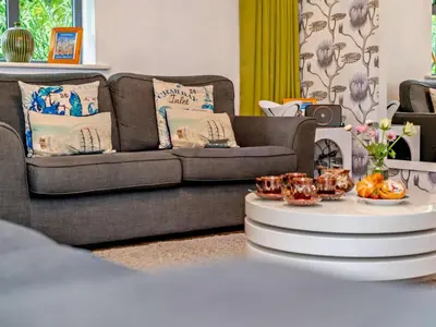 a living room with a couch and a coffee table at 4 Bed in St. Austell oc-41199 in Charlestown