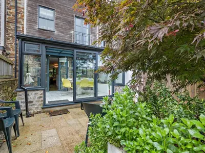 an extension to a house with sliding glass doors at 4 Bed in St. Austell oc-41199 in Charlestown