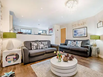 a living room with two couches and a coffee table at 4 Bed in St. Austell oc-41199 in Charlestown