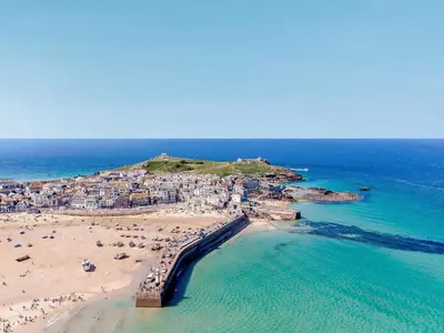 an aerial view of a beach with people and the ocean at 2 Bed in Helston oc-41378 in Cury
