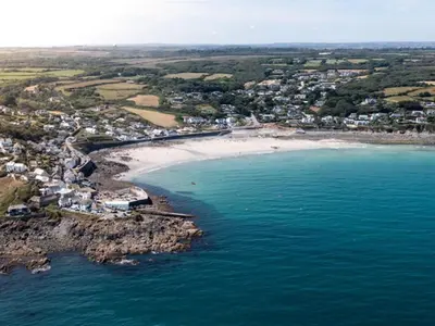 an aerial view of a beach next to the ocean at 2 Bed in Helston oc-41378 in Cury