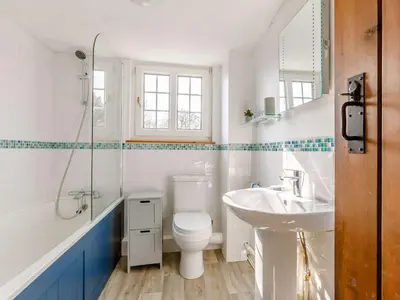 a white bathroom with a sink and a toilet at 2 Bed in Launceston oc-85912 in Trewen