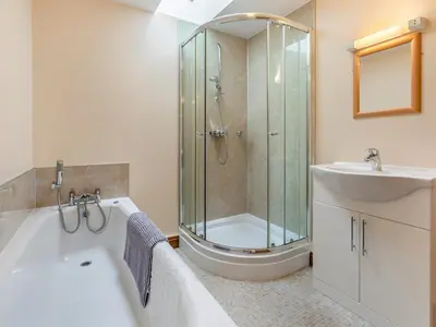 a bathroom with a shower and a tub and a sink at 1 Bed in Helston oc-bbird in Saint Martin