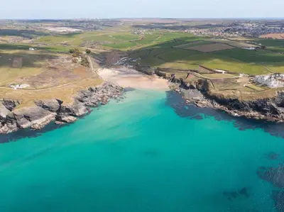an aerial view of a beach and the ocean at 1 Bed in Helston oc-41381 in Cury