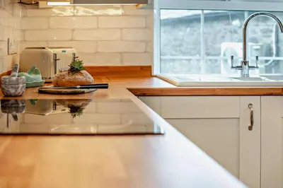 a kitchen with a counter top with a sink and a counter sidx sidx at 3 Bed in St. Breward oc-g28144 in Saint Breward