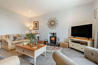 a living room with a television and a fireplace at 3 Bed in St. Breward oc-g28144 in Saint Breward