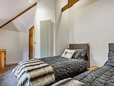a bedroom with a bed and a radiator at 2 Bed in Launceston oc-85894 in South Petherwin