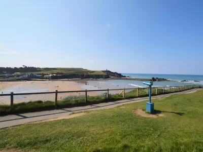 a view of a beach with a fence and the ocean at 2 Bed in Launceston oc-85894 in South Petherwin