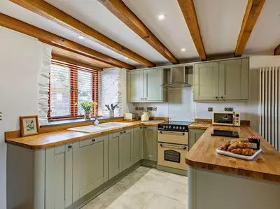 a kitchen with green cabinets and a counter top at 2 Bed in Launceston oc-85894 in South Petherwin